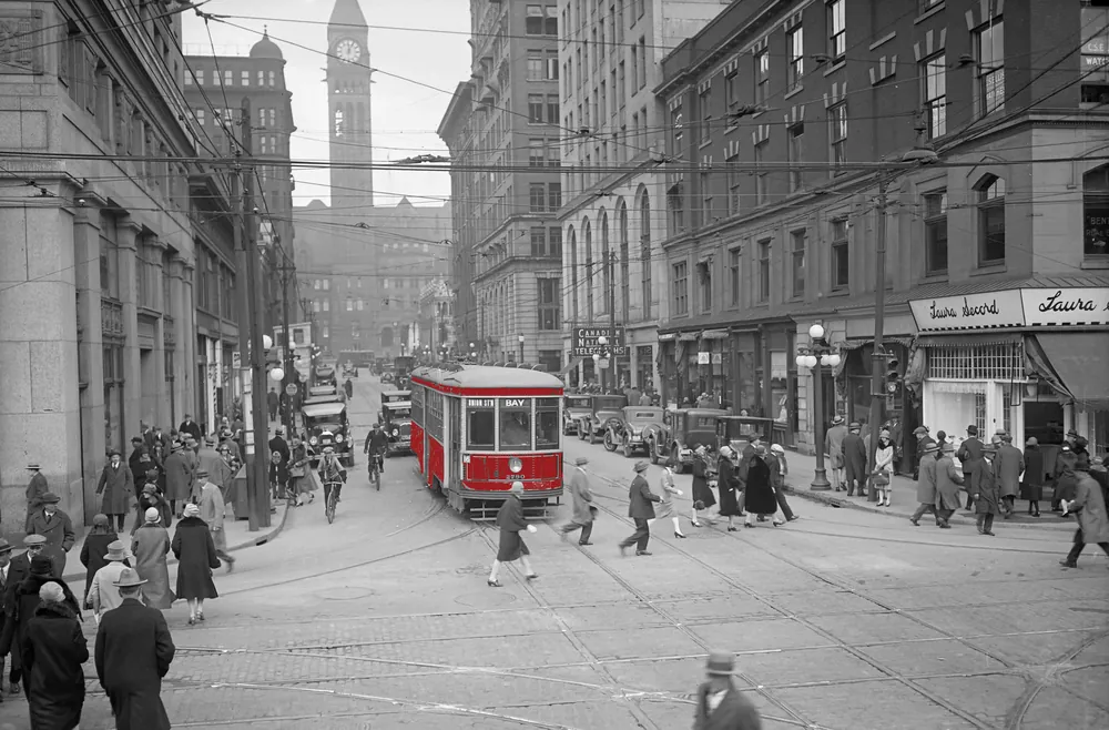 Historic Bay Street in Toronto with a red streetcar